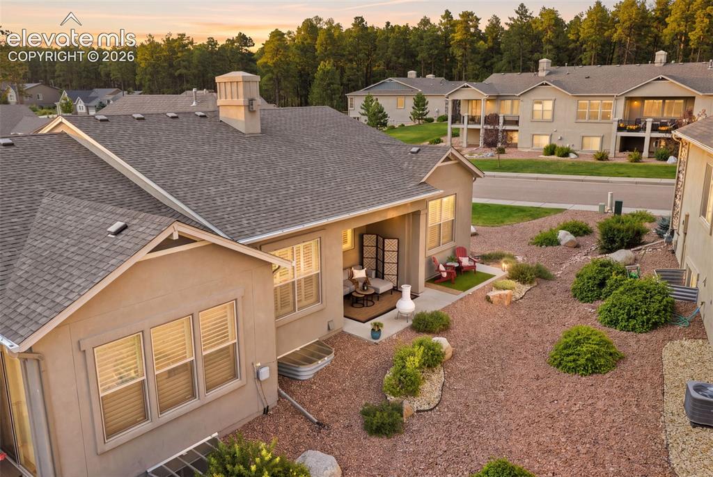 Image 36 of 43: Rear exterior view featuring the expanded patio outdoor living space, and r