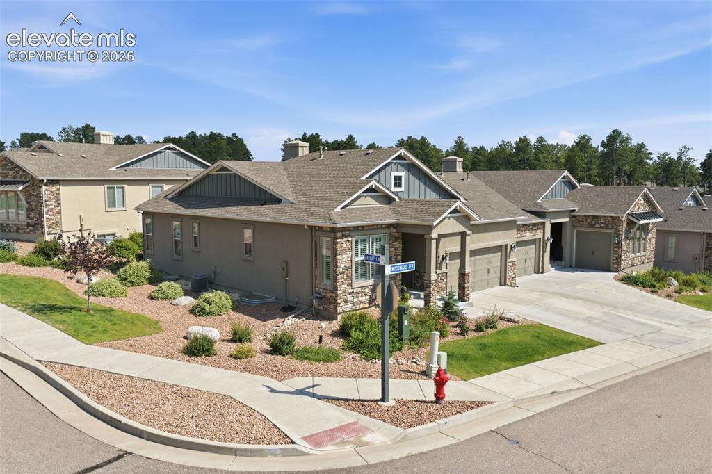 Image 39 of 43: Contemporary stucco and stone exterior.