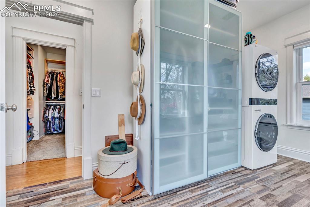 Image 22 of 50: Primary Walk-In Closet & Laundry Room