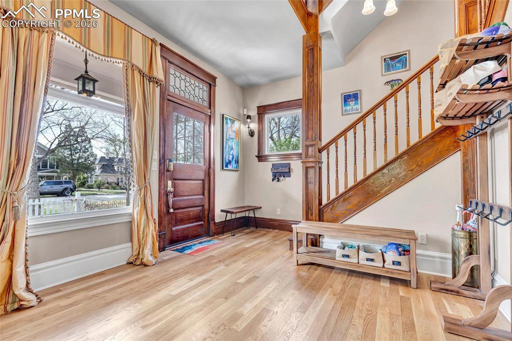 Image 9 of 50: Formal Entry with gleaming new wood floors (2024) throughout Main Level 