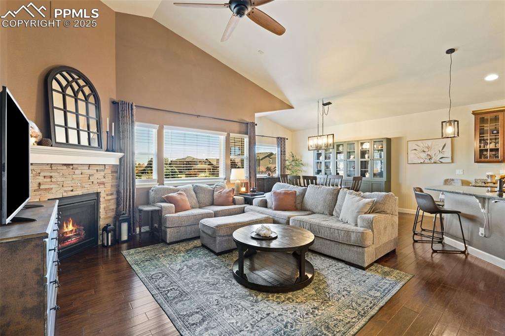 Image 11 of 31: Living area featuring plenty of natural light, high vaulted ceiling, a ceil