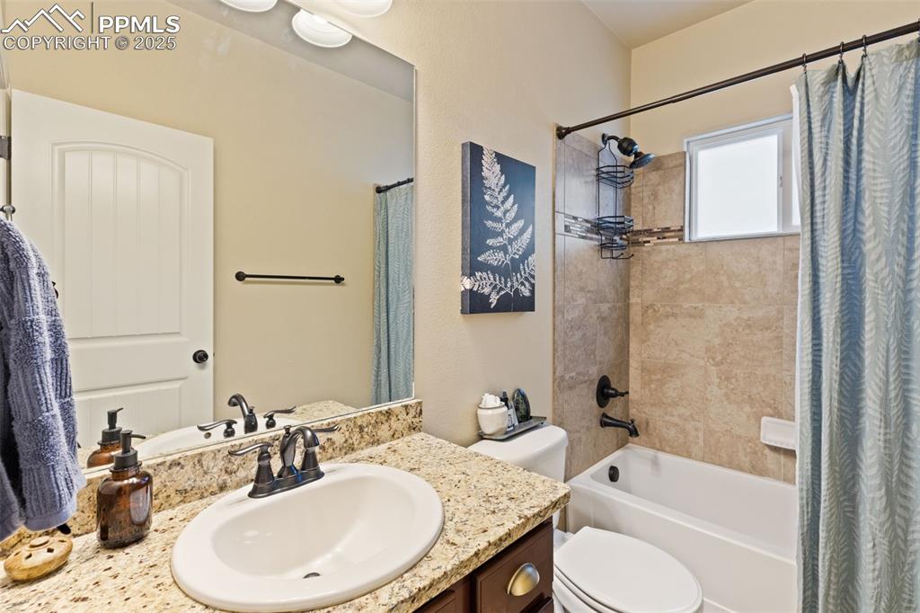 Image 22 of 31: Full bathroom featuring vanity and shower / tub combo with curtain