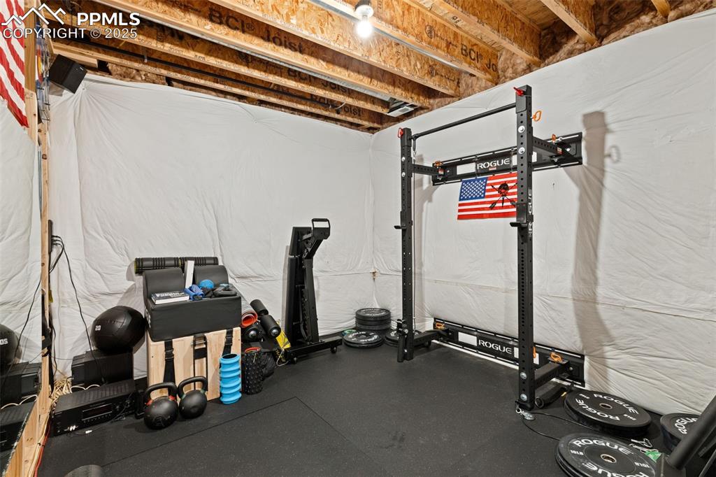Image 31 of 31: Workout area with rubber floors
