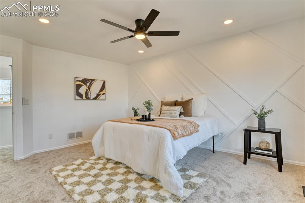 Image 20 of 45: Bedroom featuring carpet floors, ceiling fan, and recessed lighting