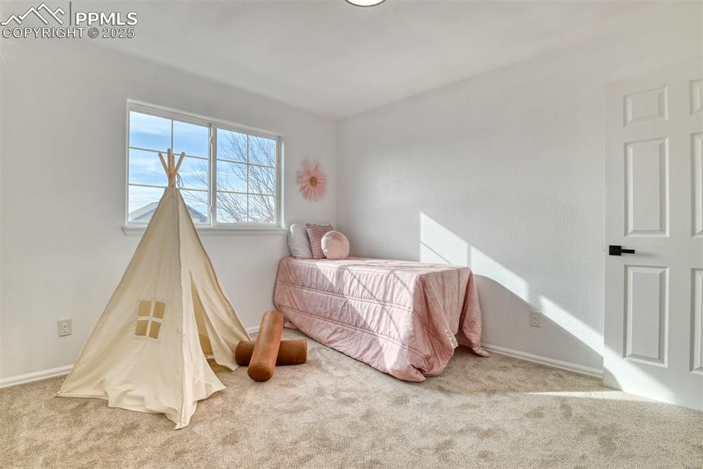 Image 27 of 45: Carpeted bedroom with baseboards