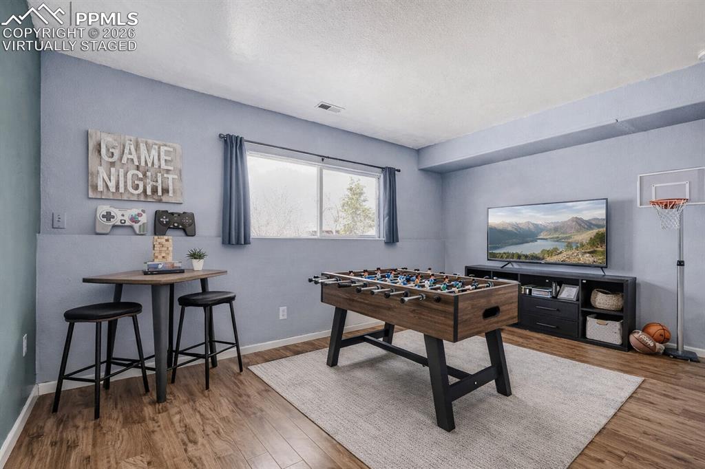 Image 6 of 41: Virtually Staged Lower Level Bonus Room