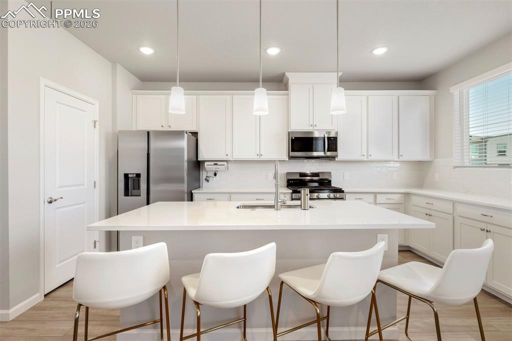 Image 10 of 24: Gourmet kitchen with a gas range and large pantry