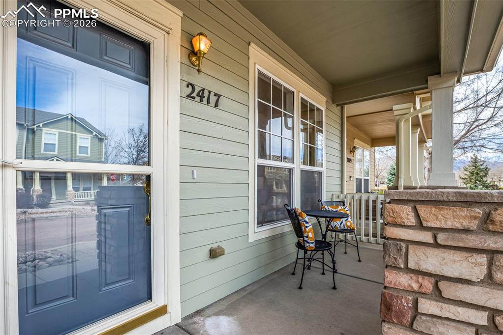 Image 35 of 35: Craftsman-style house featuring stone siding and covered porch