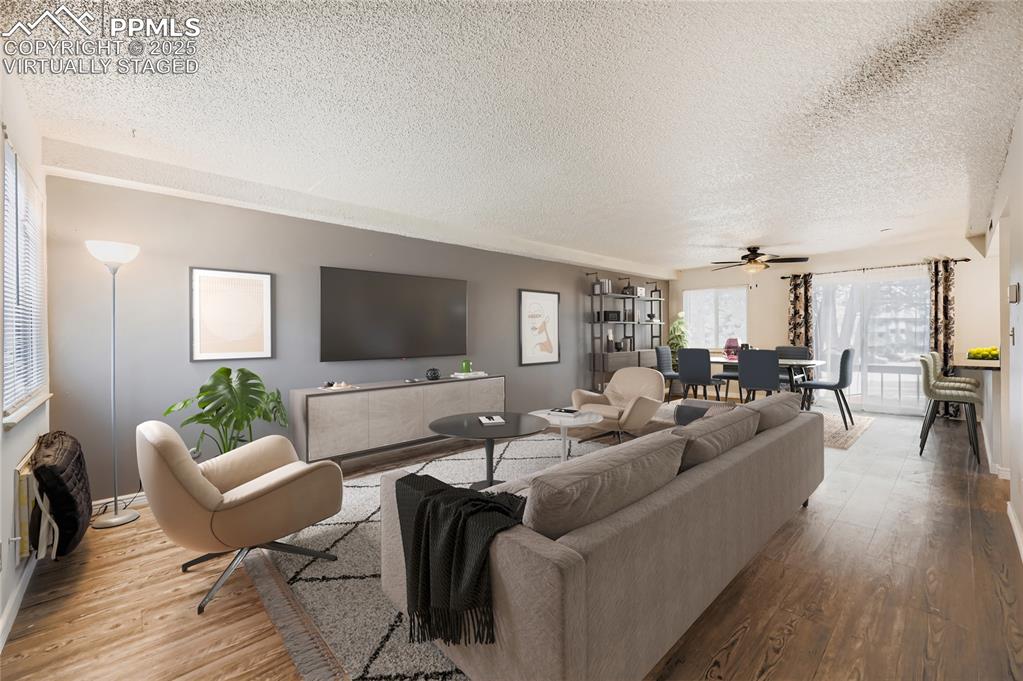 Image 4 of 29: Virtually staged great room to show potential