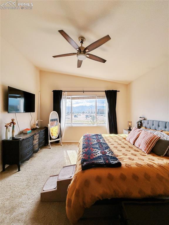 Image 17 of 36: Carpeted bedroom with a ceiling fan