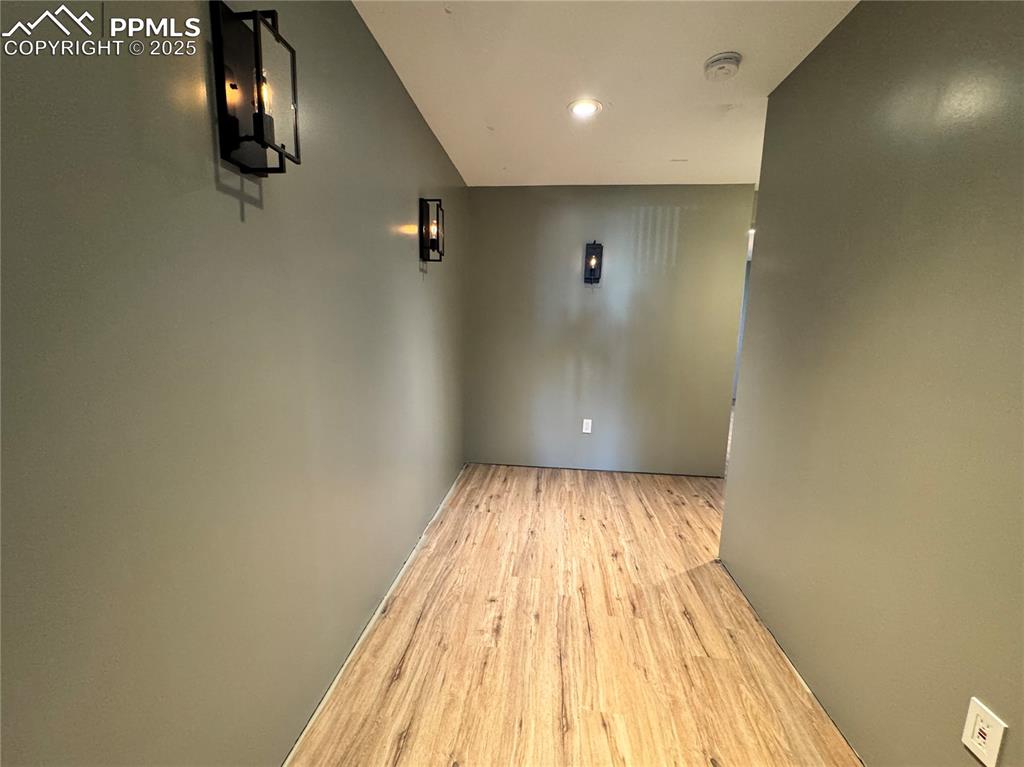 Image 33 of 36: Unfurnished room featuring wood finished floors and recessed lighting