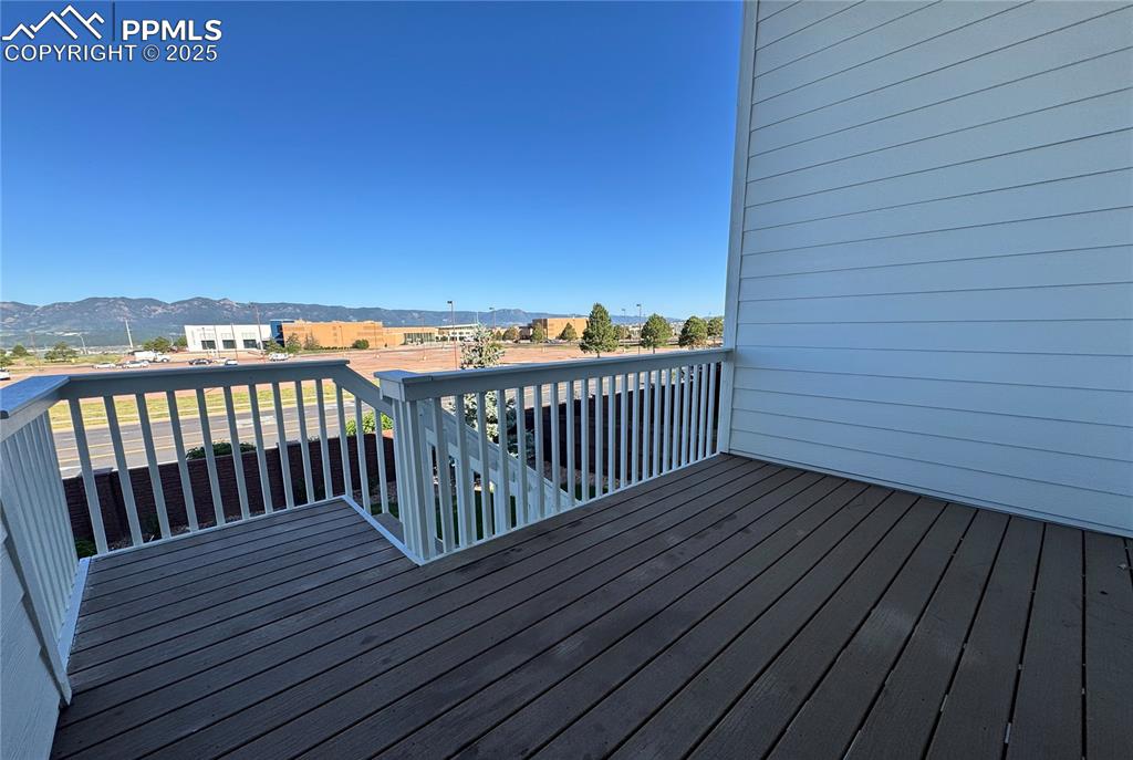 Image 35 of 36: Wooden terrace with a mountain view