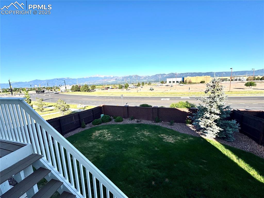 Image 36 of 36: Fenced backyard featuring a mountain view