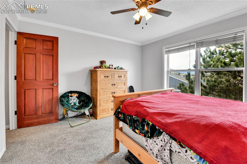 Image 17 of 30: Carpeted bedroom