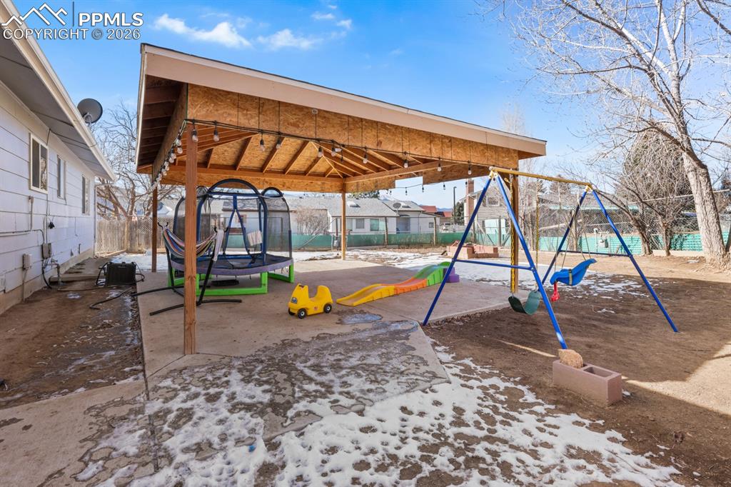 Image 37 of 37: Community play area featuring a patio