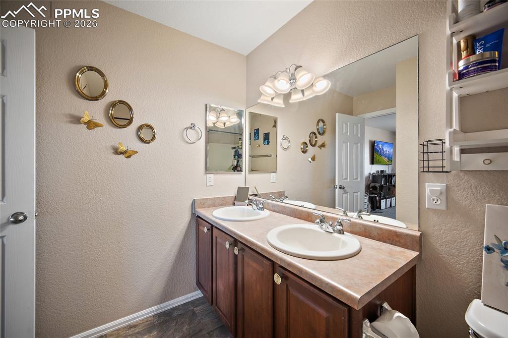 Image 21 of 47: Primary bathroom featuring double vanity