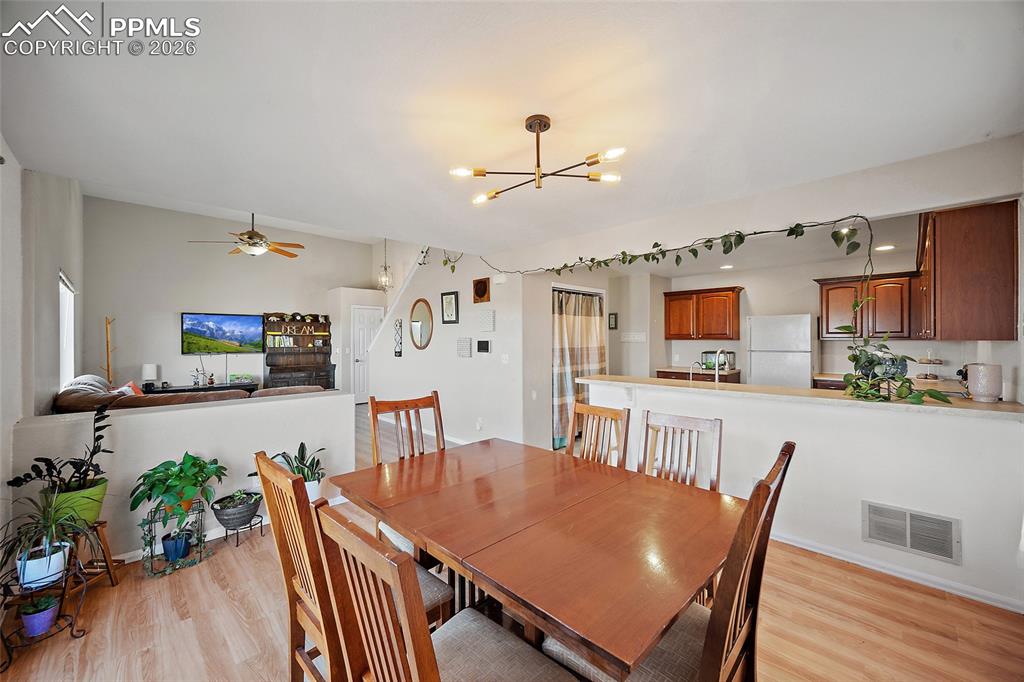 Image 7 of 47: Dining area with modern lighting