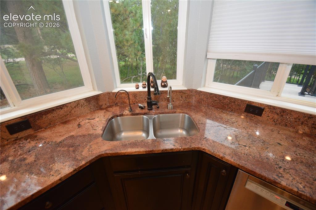 Image 11 of 48: Corner Sink with great natural light.