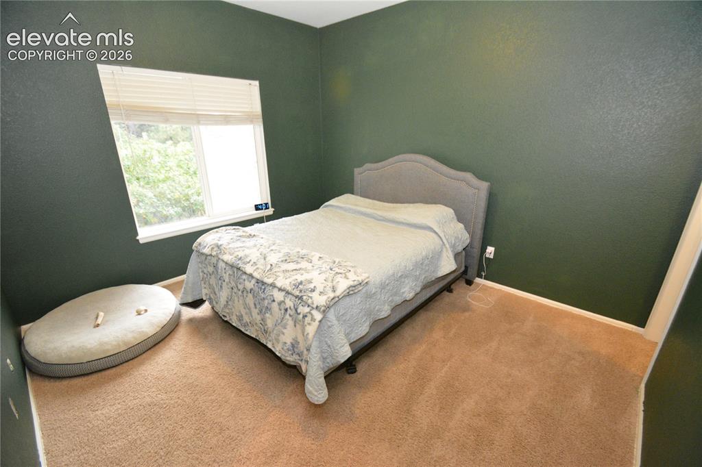 Image 22 of 48: Main level bedroom with walk in closet