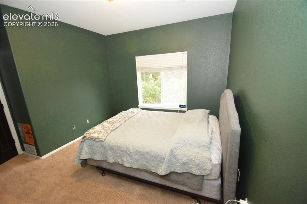 Image 23 of 48: Main level bedroom