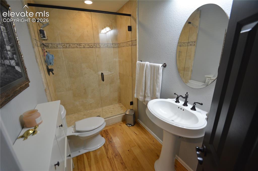 Image 24 of 48: 3/4 bath on main level right next to main level bedroom.