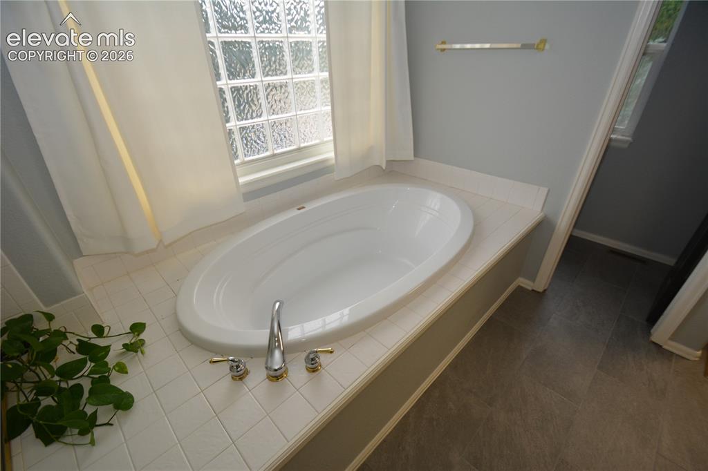 Image 29 of 48: primary bath, separate tub.