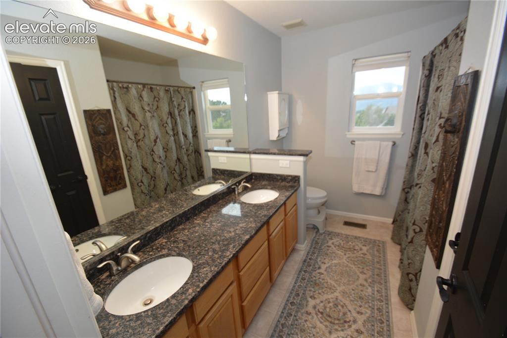 Image 33 of 48: 2nd full bath upstairs.  Double vanity.  