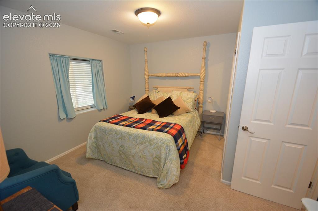 Image 36 of 48: Basement bedroom