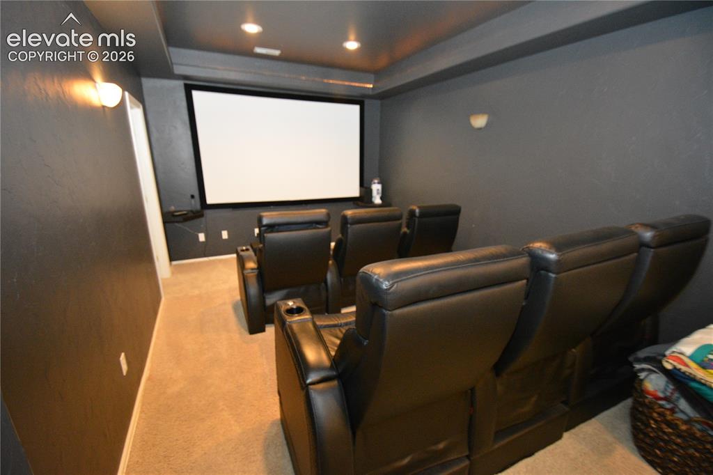 Image 42 of 48: Media room in basement just off living room.  