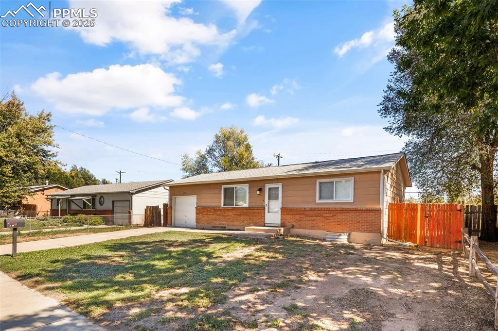Image 3 of 25: Ranch-style home featuring brick siding, concrete driveway, entry steps, an