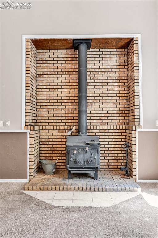 Image 19 of 41: Wood burning fireplace