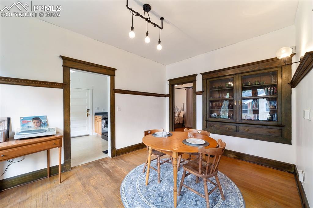 Image 7 of 50: Formal dining room with built-in china cabinet
