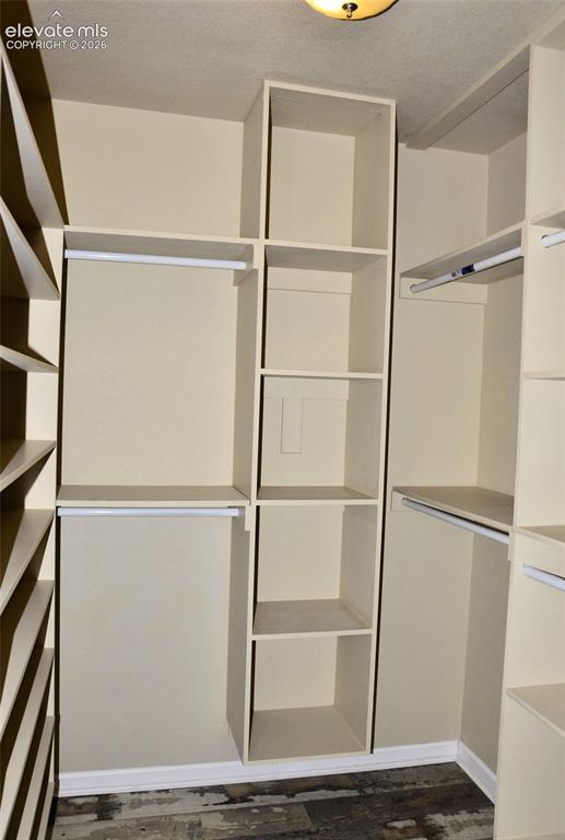 Image 13 of 15: Main bedroom walk-in closet