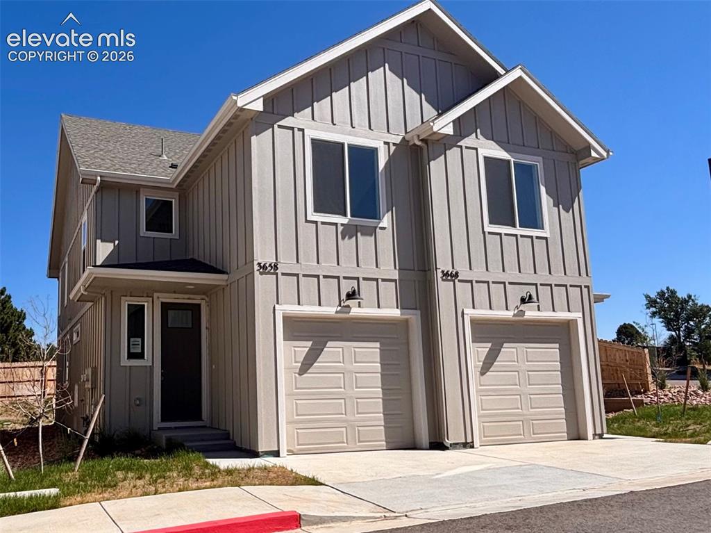 Caption: Contemporary two-story exterior with board and batten siding