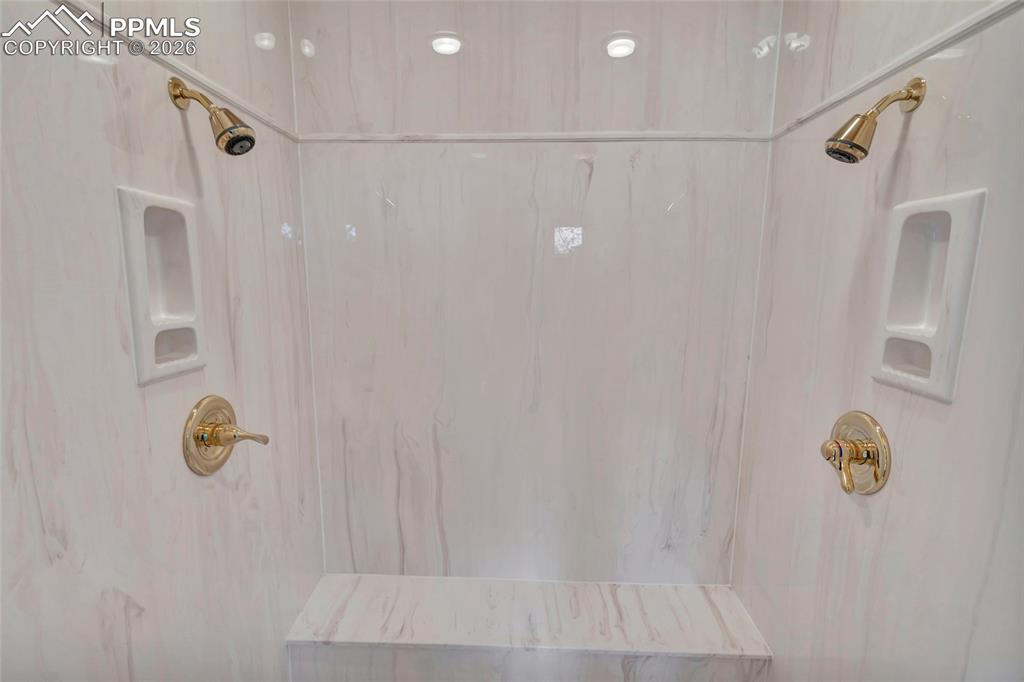 Image 32 of 44: Dual Shower Heaks in Primary Bathroom