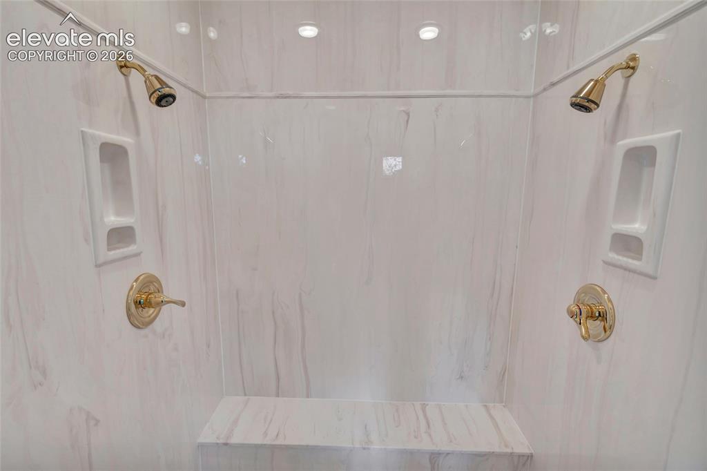 Image 32 of 50: Dual Shower Heaks in Primary Bathroom