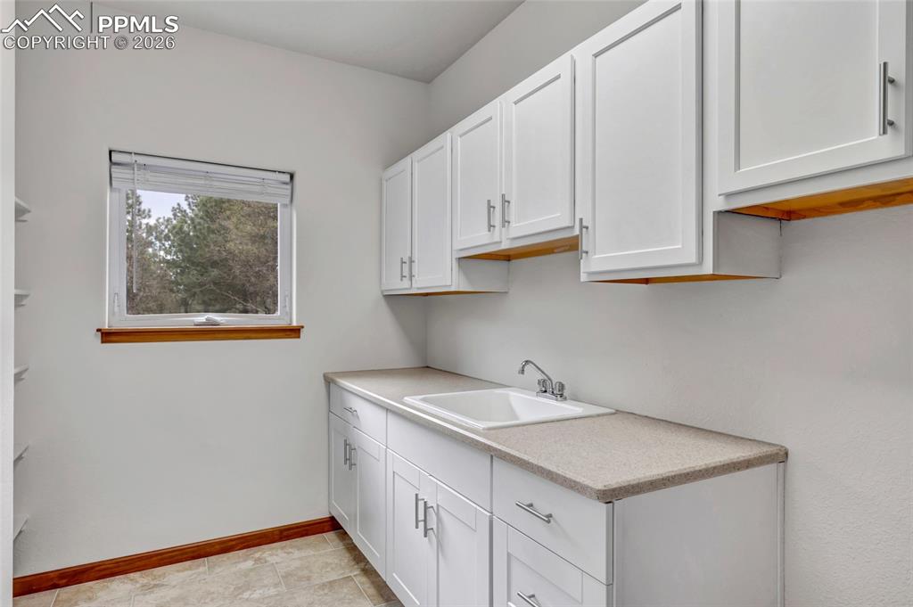 Image 35 of 44: Large Laundry with deep sink