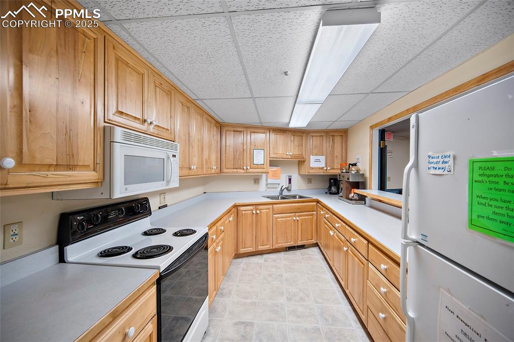 Image 23 of 49: Second kitchen on lower level
