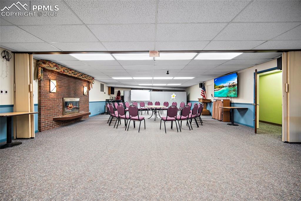 Image 24 of 49: Large meeting room with fireplace
