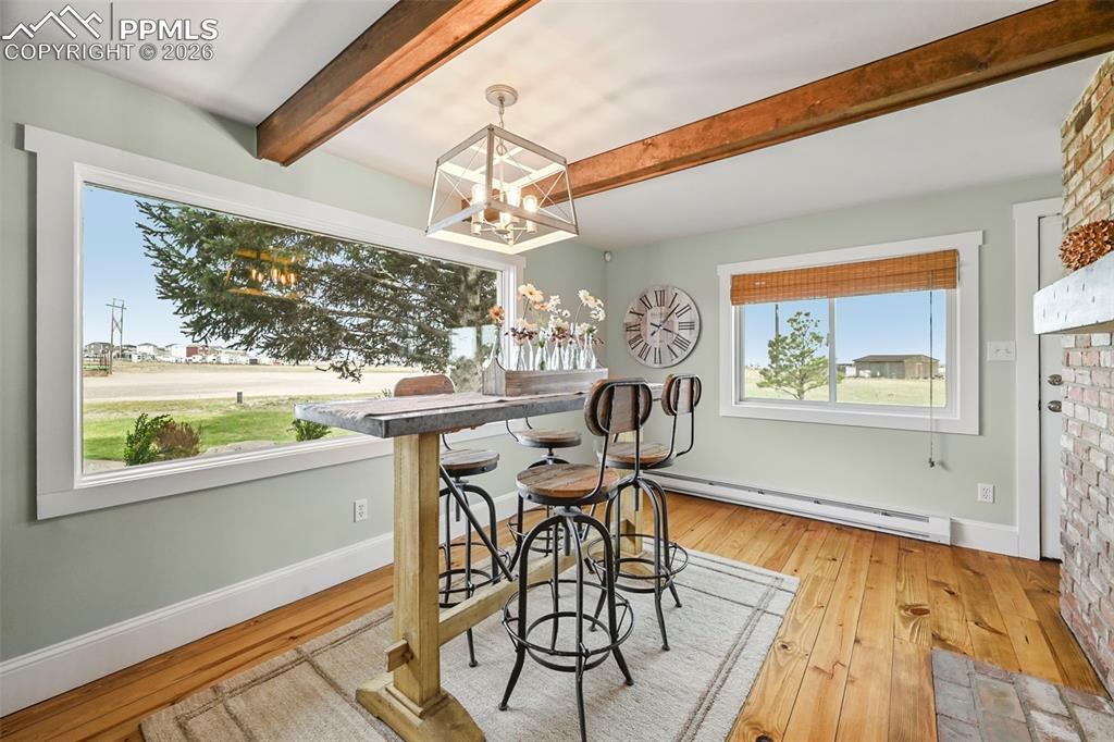 Image 11 of 50: Eat-in Kitchen portion- abundant natural light