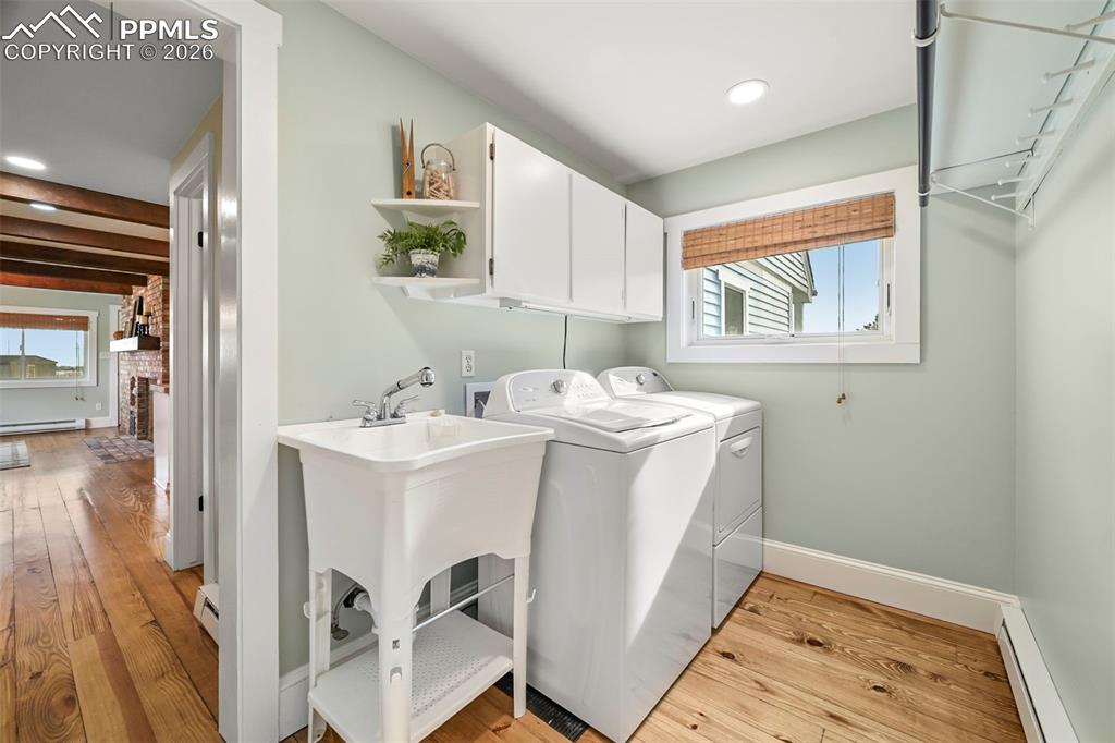 Image 16 of 50: Laundry machines and sink included in the sale.