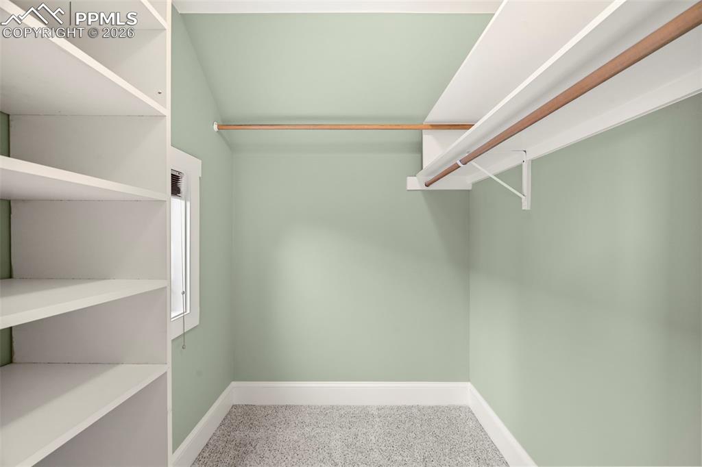 Image 20 of 50: Primary bed walk-in closet