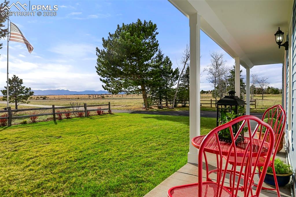 Image 4 of 50: Serene front porch with mountain views