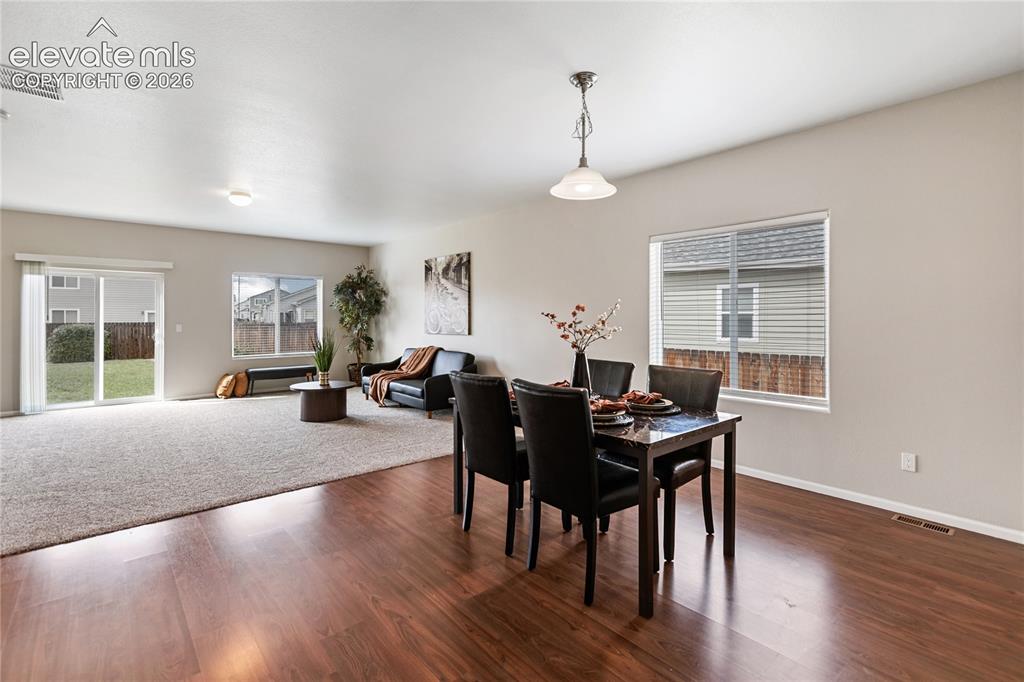 Image 15 of 46: Dining/living room area is open and perfect for entertaining!
