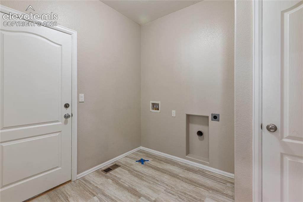 Image 26 of 46: Brand new flooring in the laundry/mud room