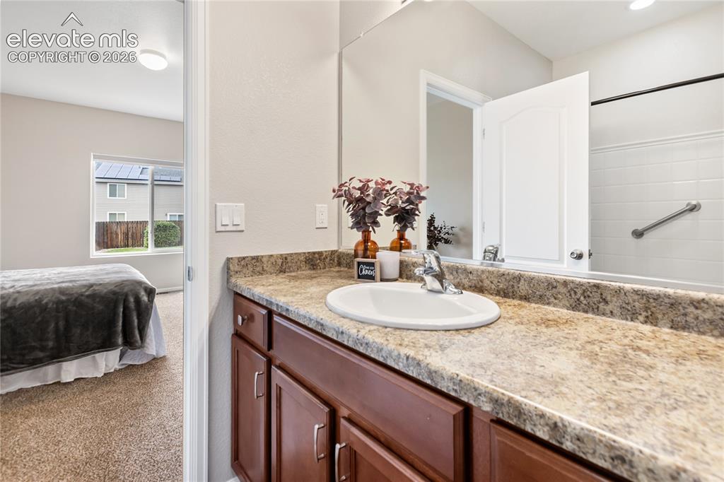 Image 29 of 46: Primary bathroom - spacious countertop and oversized tub/shower
