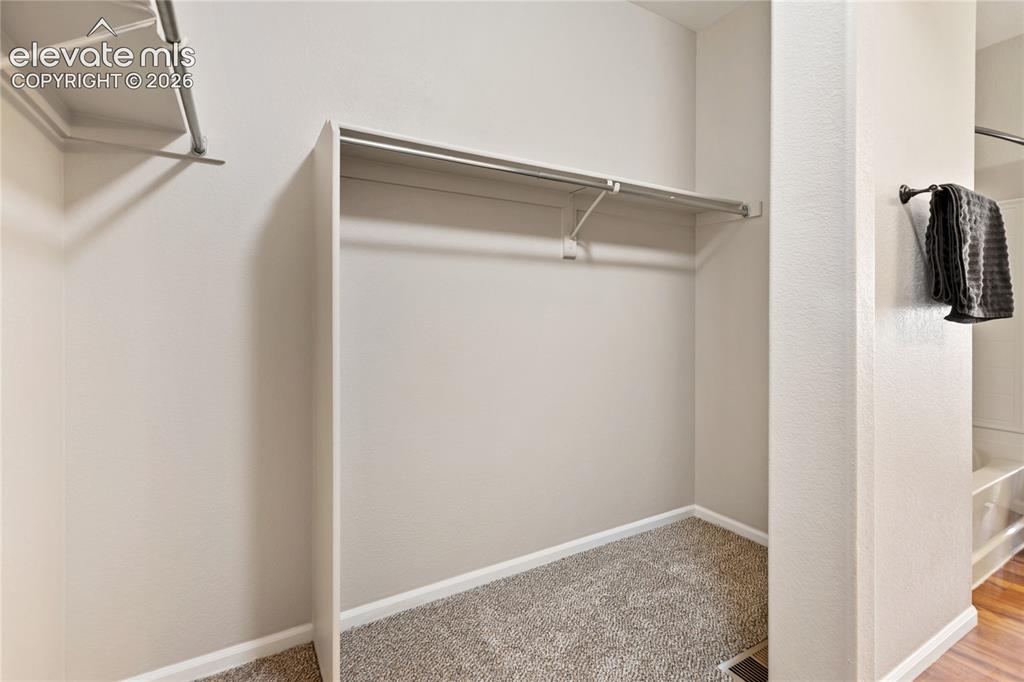 Image 33 of 46: Primary closet