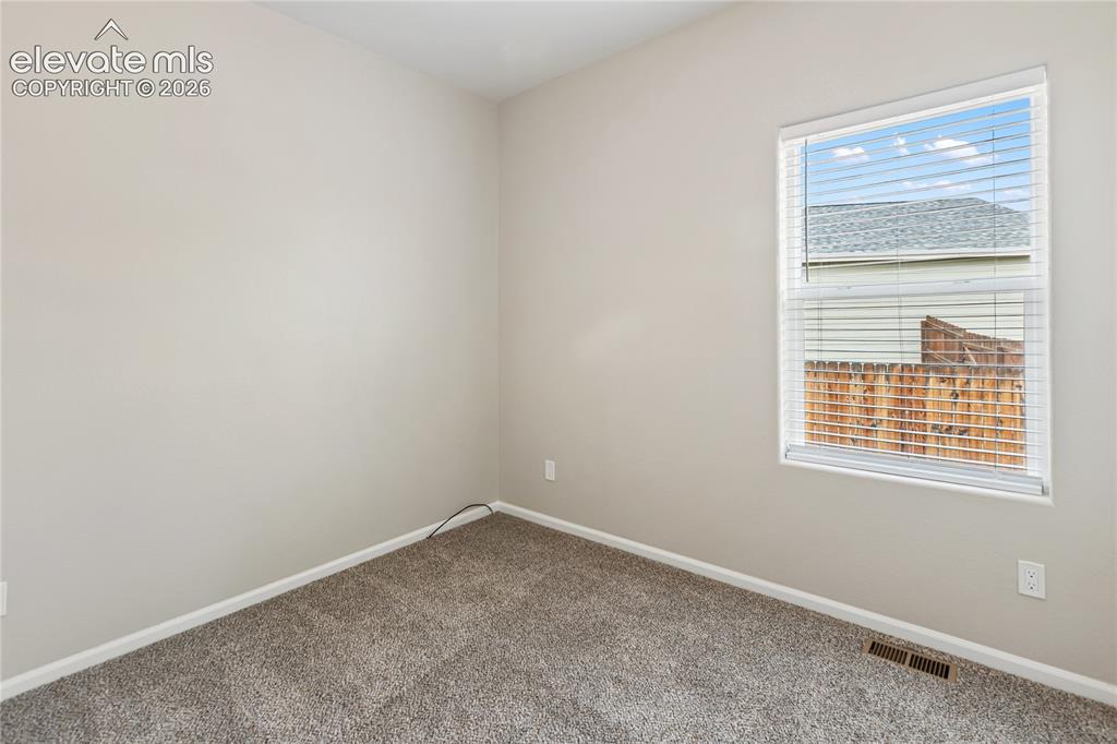 Image 35 of 46: Bedroom #2 - new carpet and freshly painted 