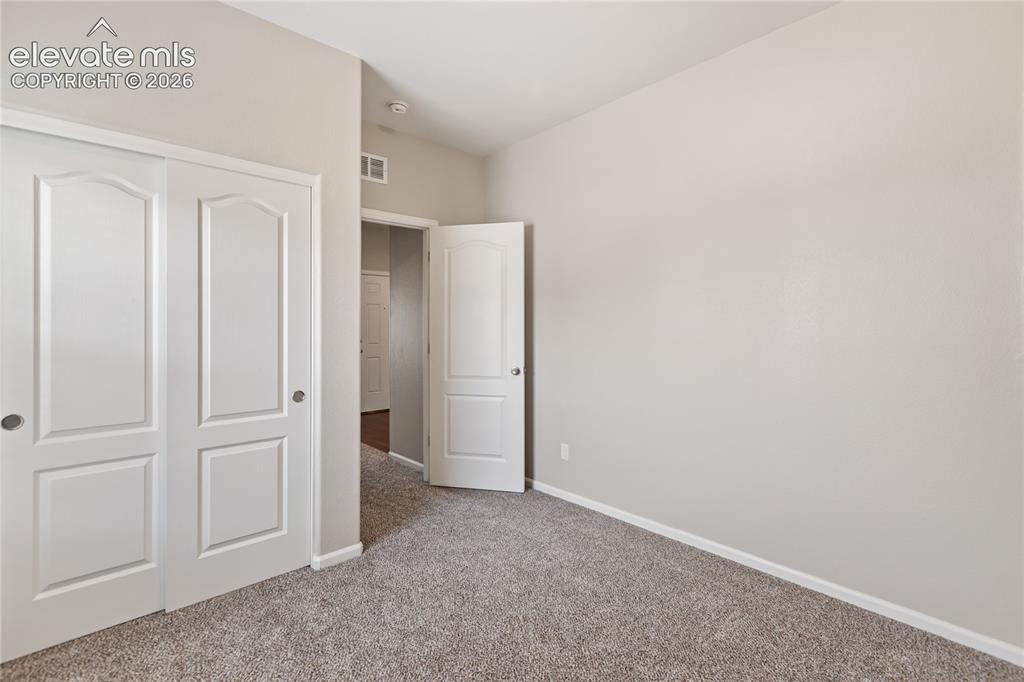 Image 37 of 46: Bedroom #2 - new carpet, freshly painted!