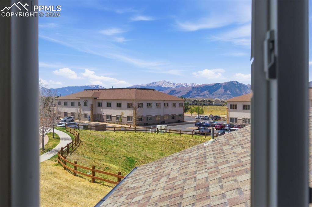 Image 25 of 34: A View of Distant mountain range backdrop, expansive blue sky, and nearby b